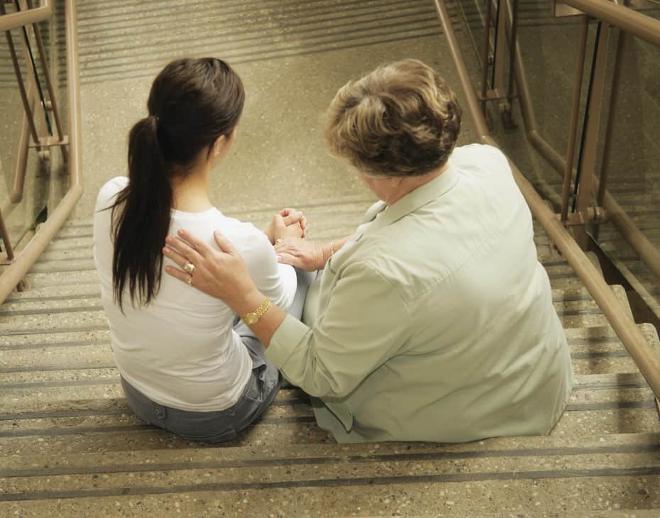 Our_Services_Hospice_930x730 Elderly Woman Comforts a Young Woman on the Stairs