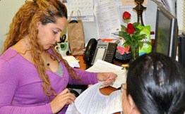 NORCPrograms_EducationalPrograms Woman at Desk Studying Paperwork