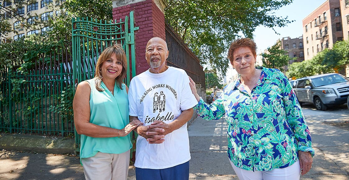 community-programs Elderly Man Smiles and Walks with Two Women