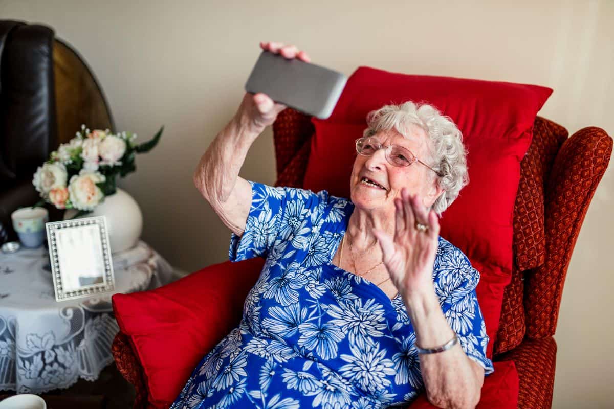 Senior Speaking to Caregiver on Video Call