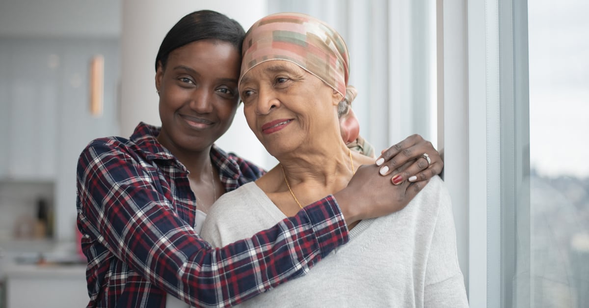Young Woman Hugging Senior Woman
