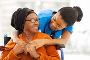 Caregiver and patient embracing